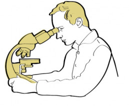 man looking into a microscope