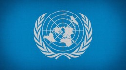 The Logo of the United Nations on a blue background.